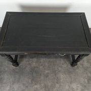 Louis XIII style desk in blackened wood with turned legs and two drawers.