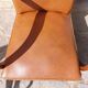Low armchair, brown imitation leather