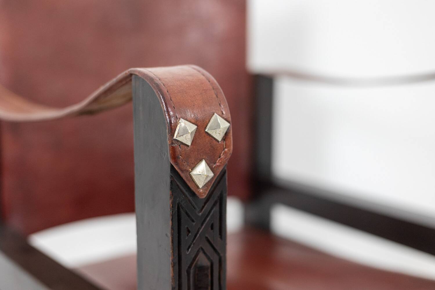 “Safari” armchair in wood and cognac leather. 1960s/70s.