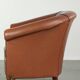 Cowhide club armchair in English style with comfortable seating.
