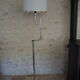 Flexible floor lamp, chrome, opaque white shade with metallic edges.