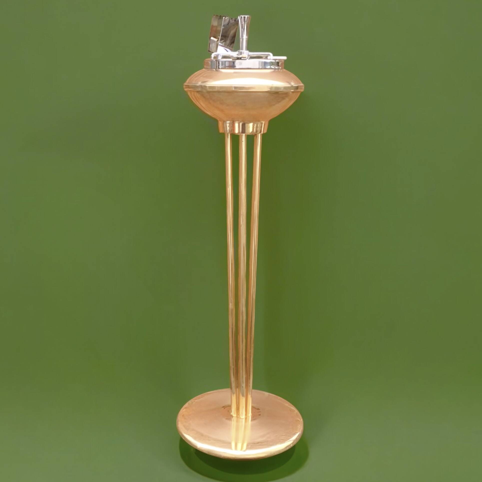 Old brass and chrome-plated metal ashtray on stand