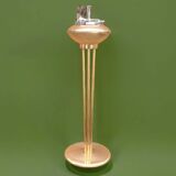 Old brass and chrome-plated metal ashtray on stand