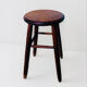 Vintage four-legged stool made of solid wood from the 1970s/80s.
