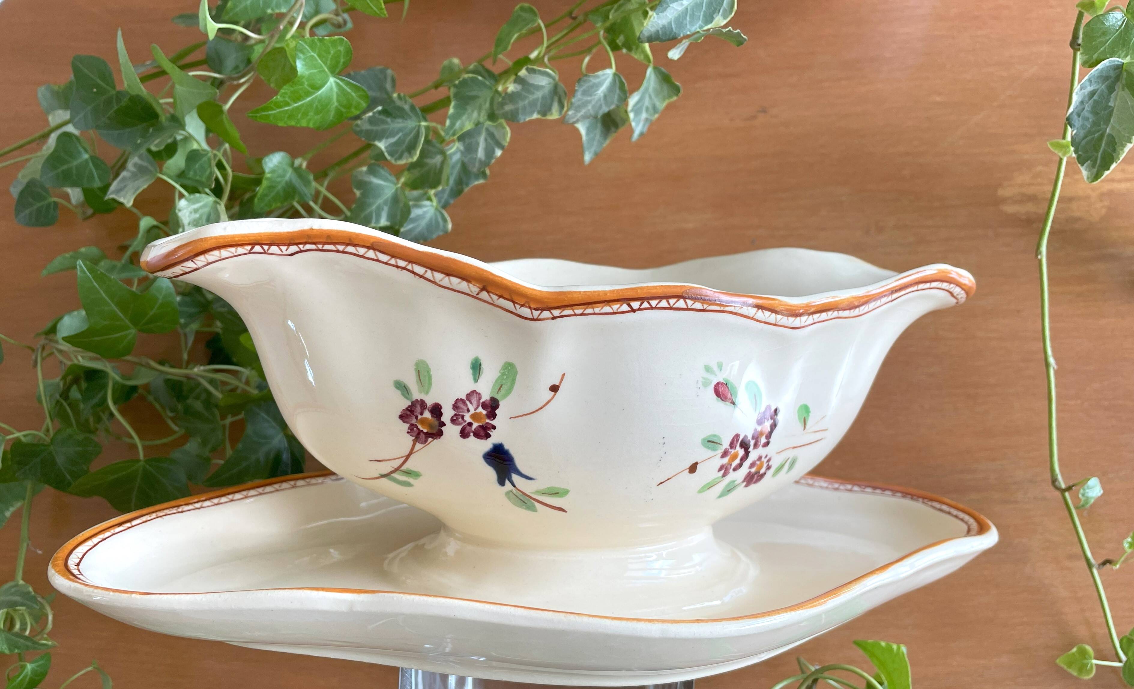 Large antique sauceboat in Longchamp earthenware.