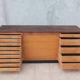 Workshop furniture with drawers and curtain in beech and walnut.