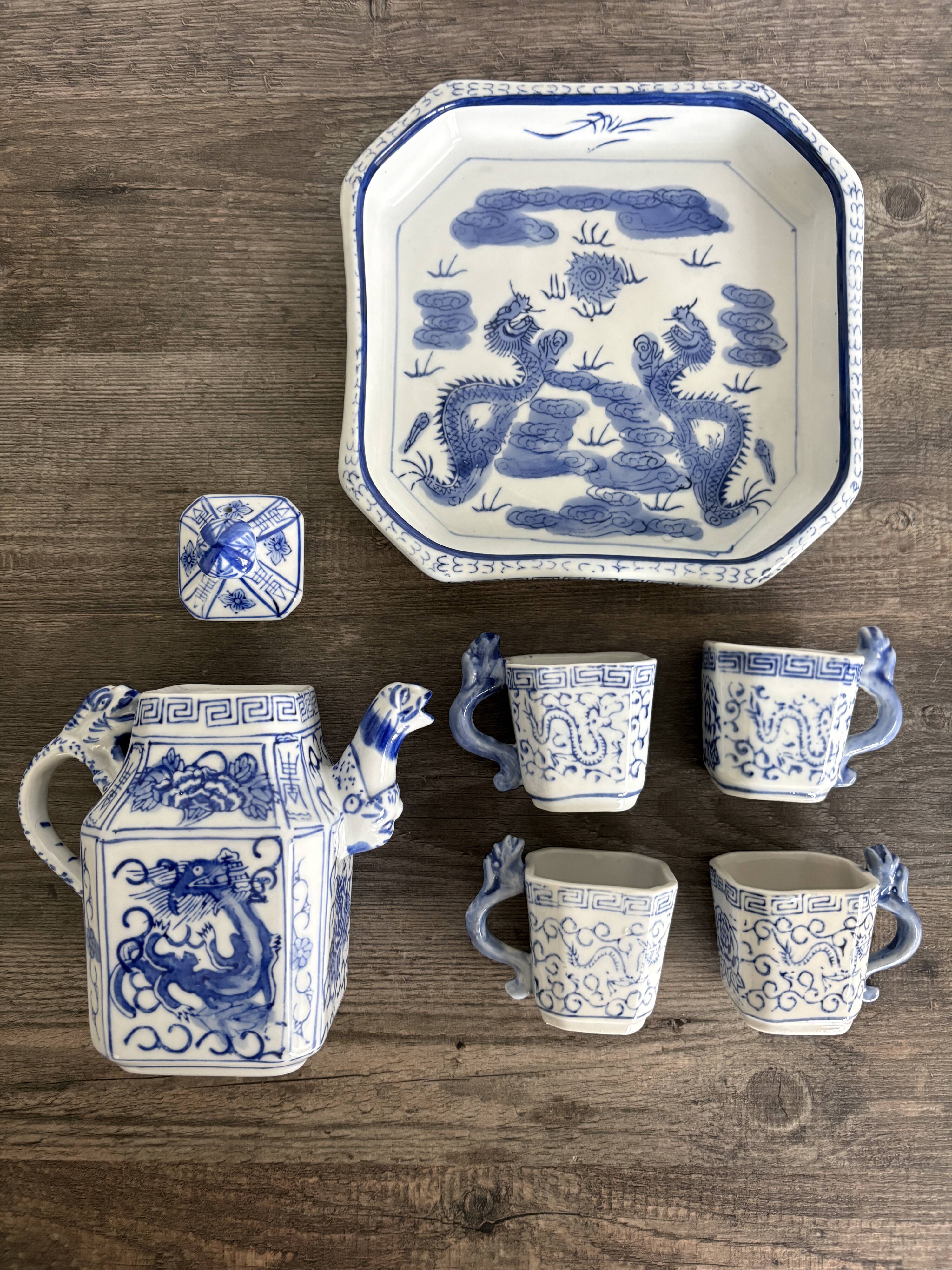 Antique Chinese tea set decorated with dragons.