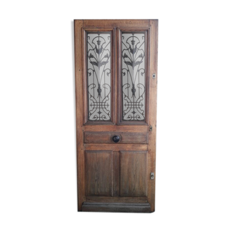 Old entrance door, glazed oak cast iron grilles 1925