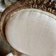Medallion back chair in moulded wood and beige fabric.