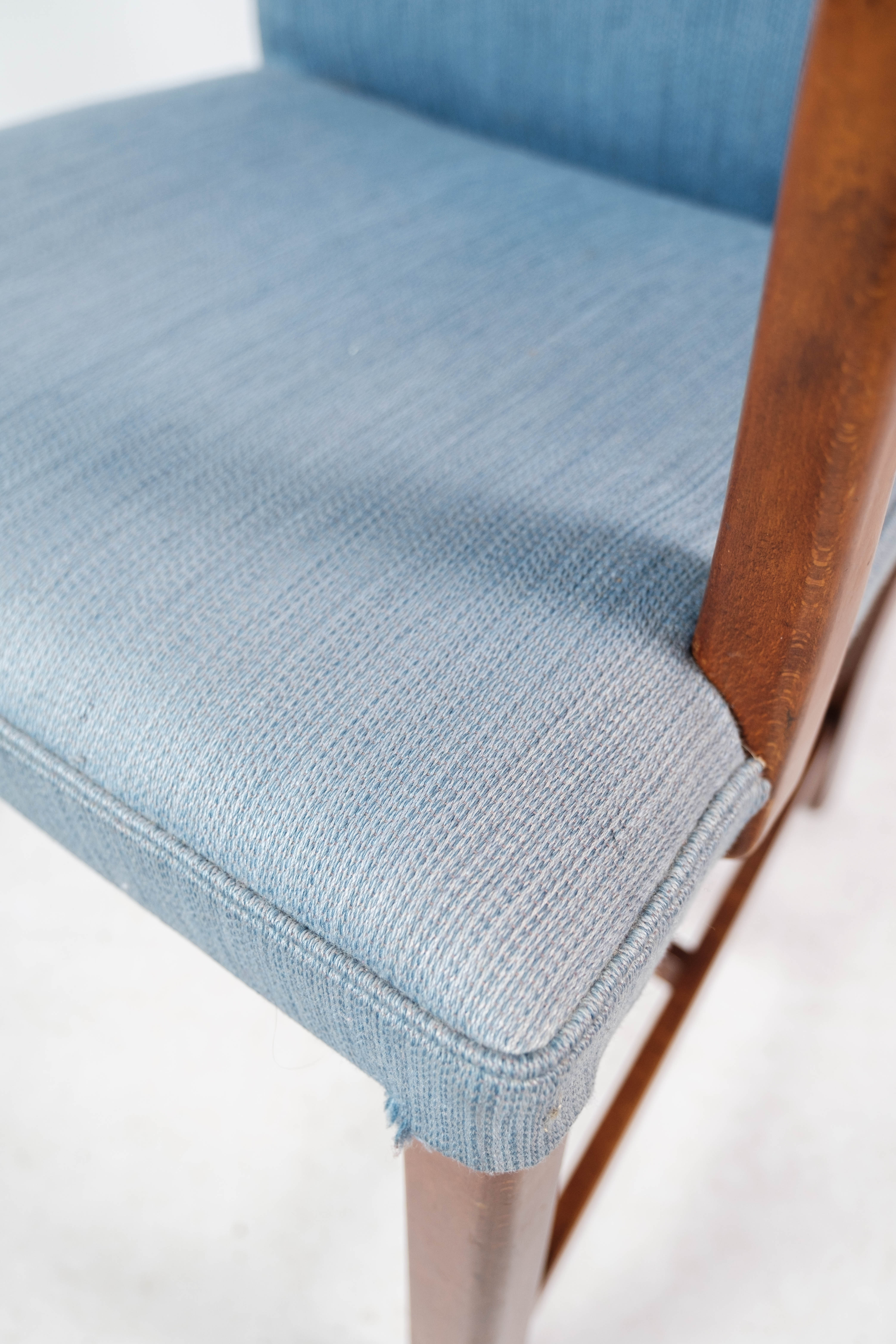 Armchair in mahogany and upholstered with light blue fabric by Fritz Hansen