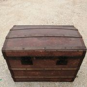 Old bombed travel trunk