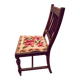 Wooden chair with embroidered seat