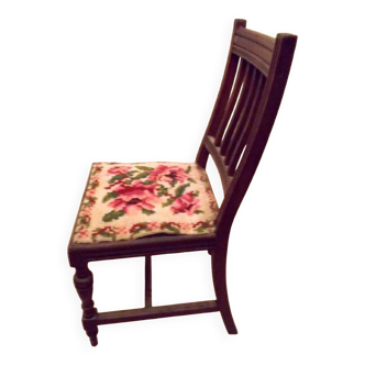 Wooden chair with embroidered seat