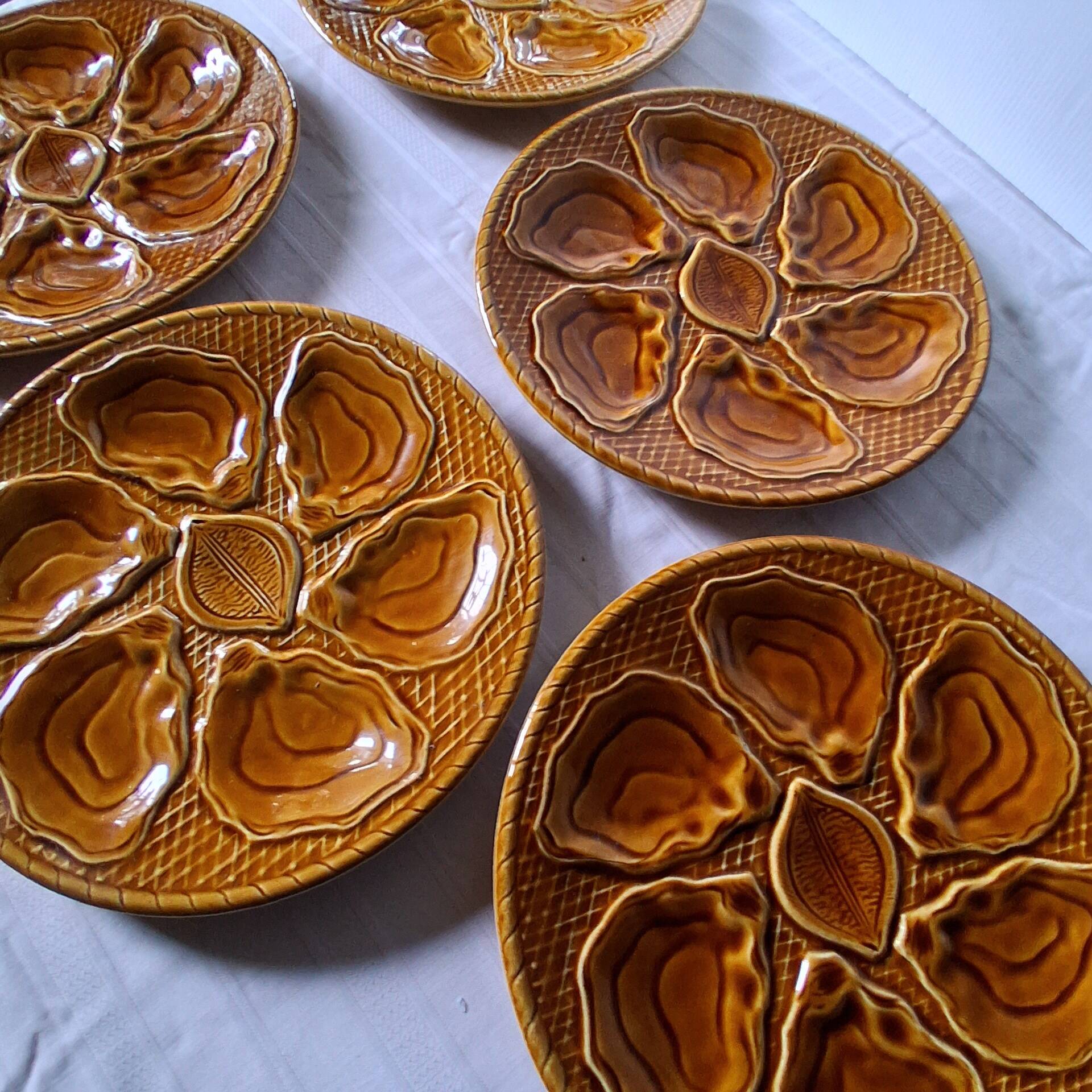 5 oyster or brown shell plates in good condition