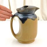 Vintage art deco water pitcher with drippy dark blue glaze.