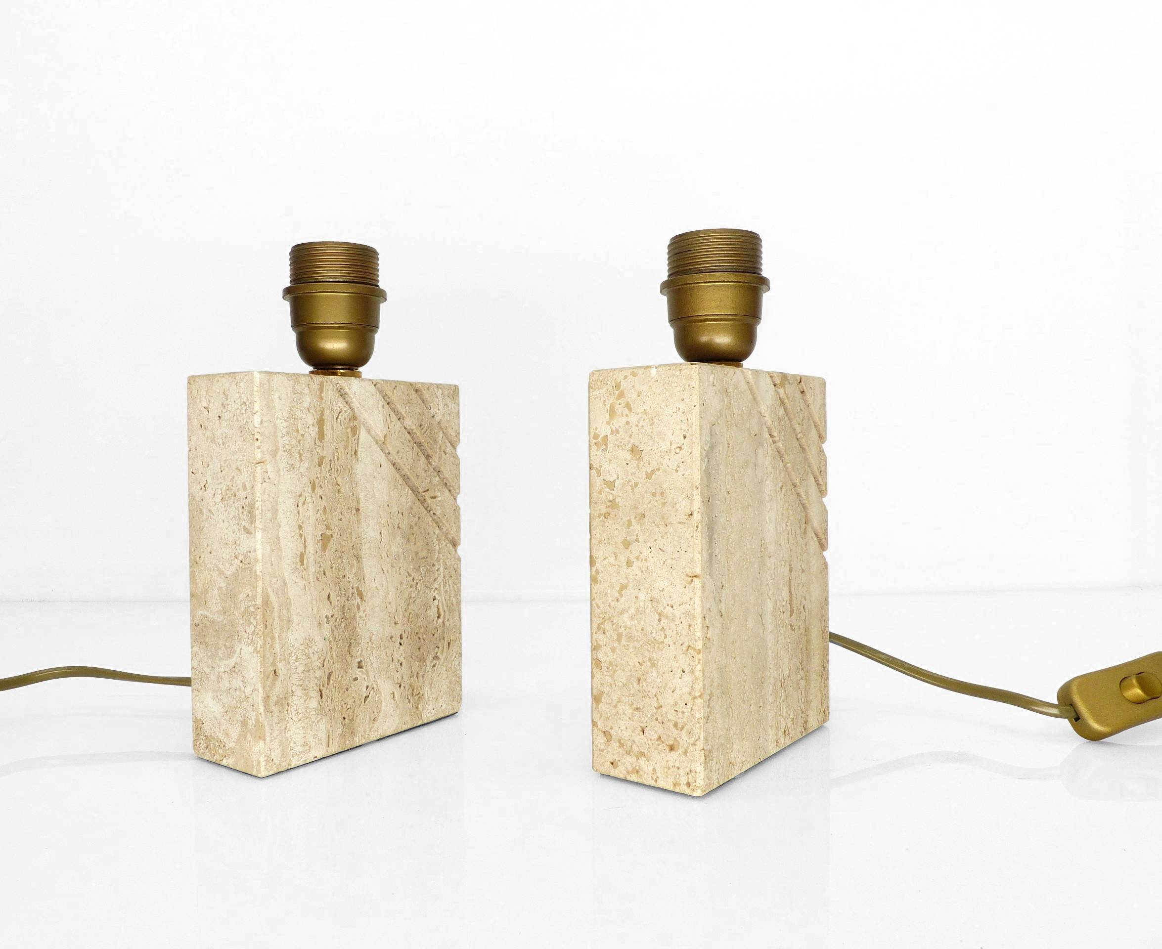 Pair of solid travertine table lamps with incised decoration, French production.