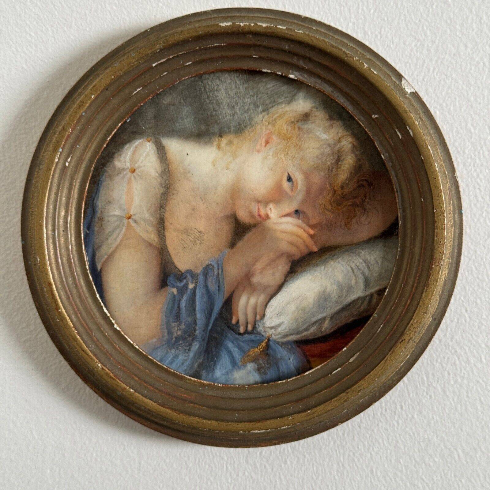 19th century miniature of a young girl with her head resting on a cushion