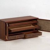 Small Japanese cabinet with sliding doors, Kabuki decoration, made of paulownia wood, early Showa period, circa 1926–1970.