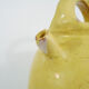 Old jug, chevrette, water pitcher in glazed yellow sandstone. Early twentieth century