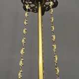 Antique chandelier in gilded bronze with crystal pendants.