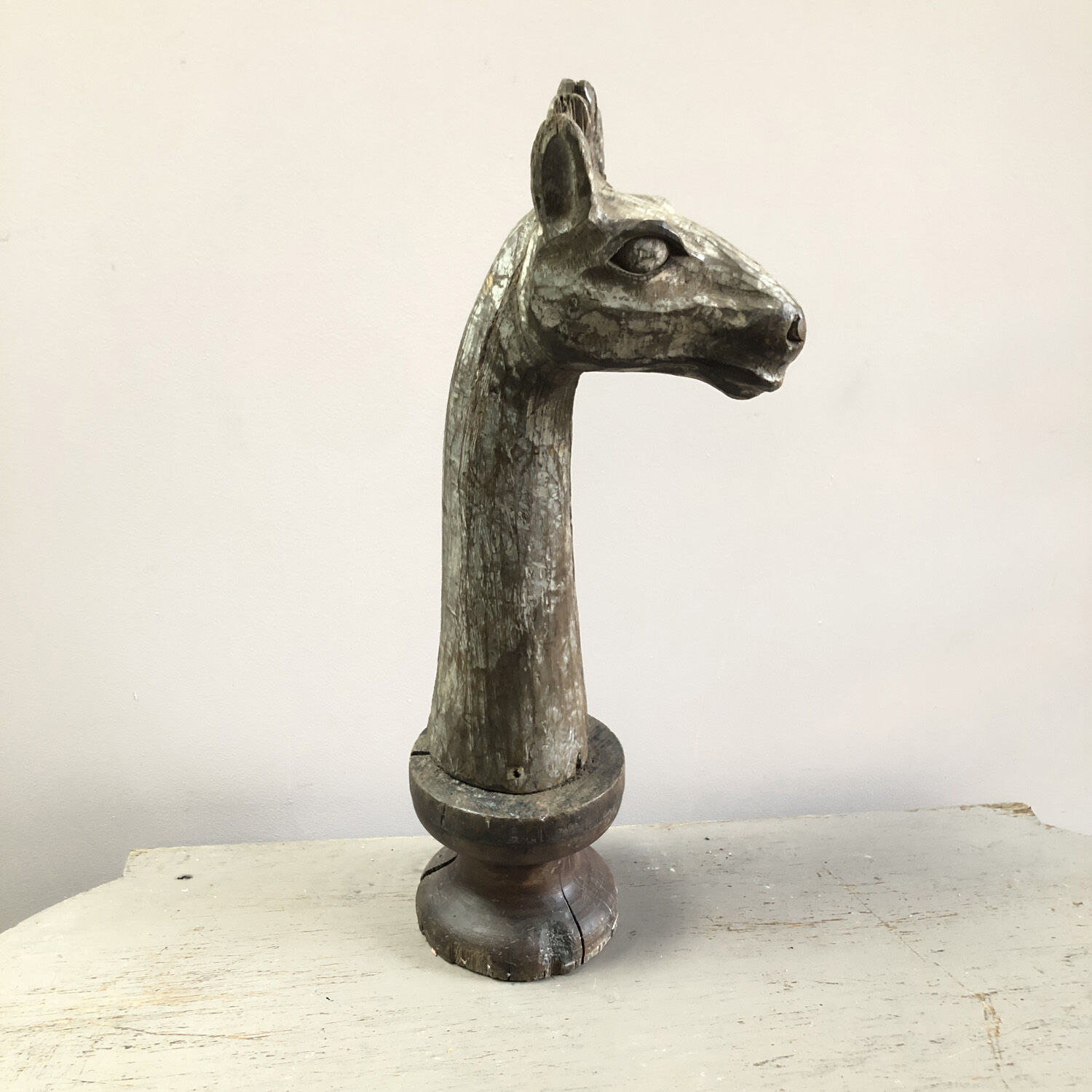 Wooden giraffe sculpture