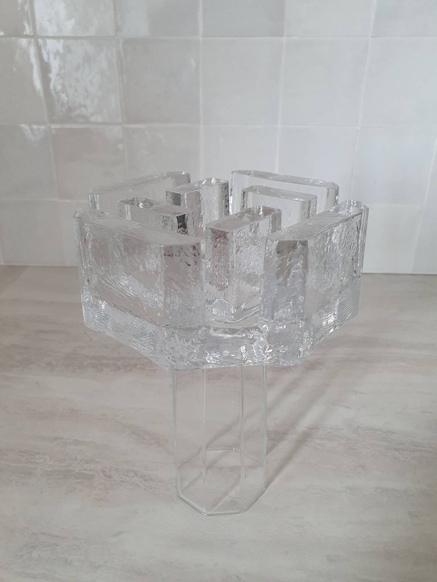 Candle holder or glass warmer with irregular ice effect.