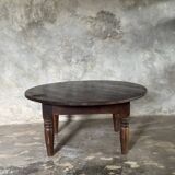 Coffee table, round antique Indonesian teak table with straight legs.