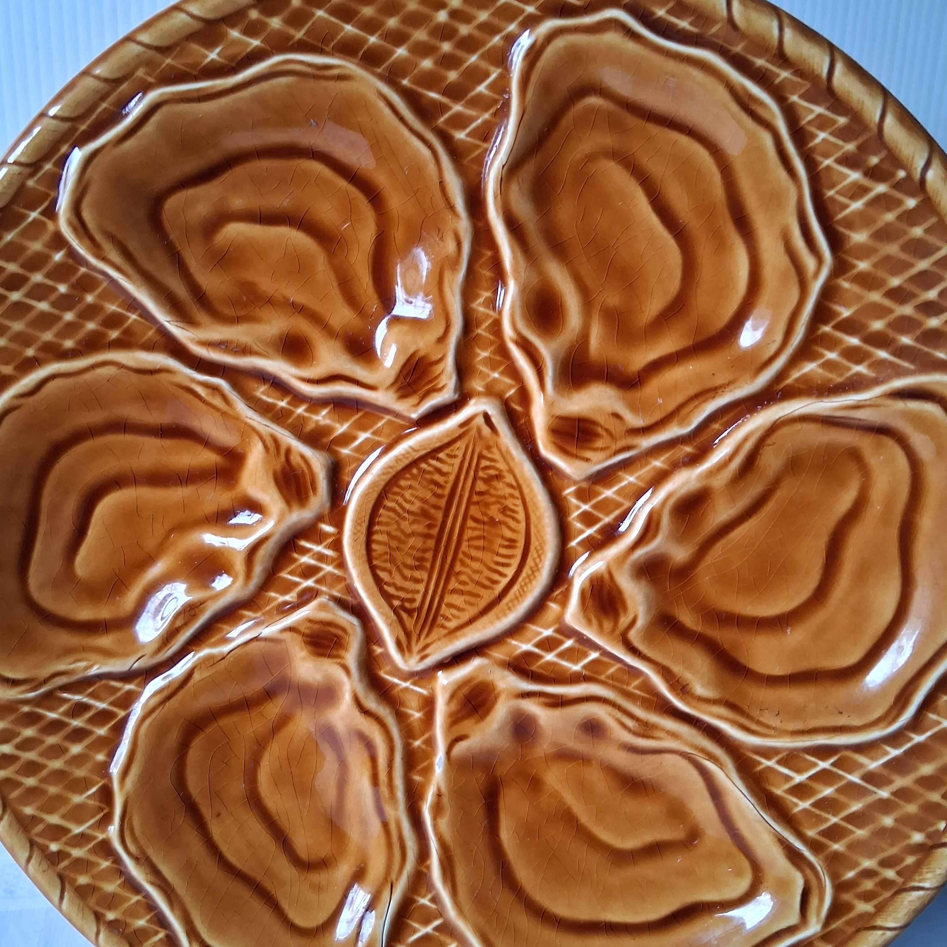 5 oyster or brown shell plates in good condition