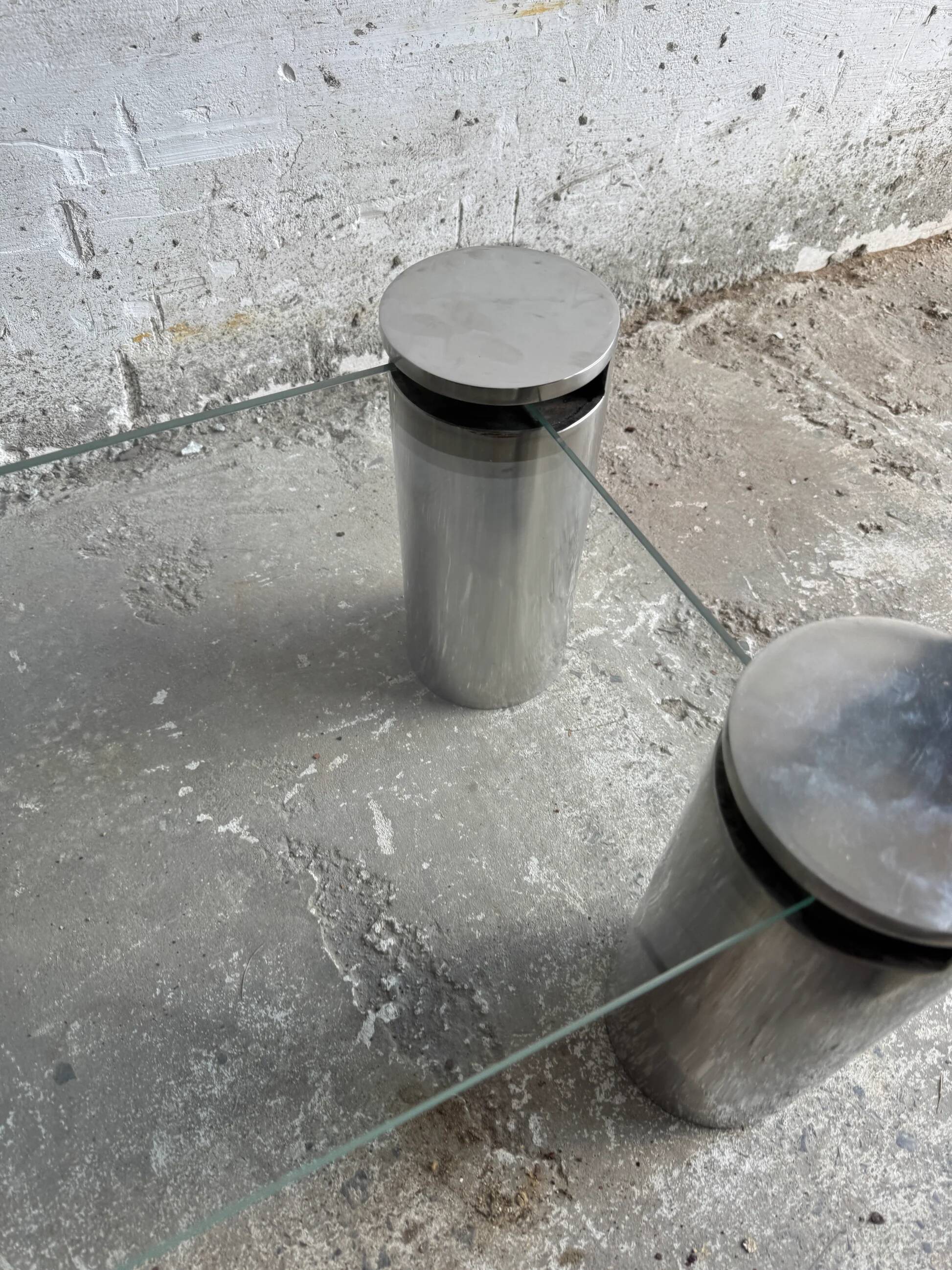 Pair of modernist coffee tables with cylindrical steel legs