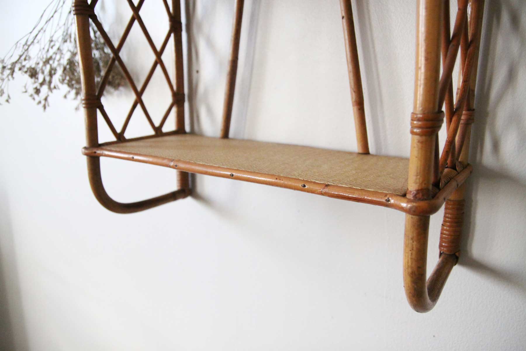 Rattan wall shelf