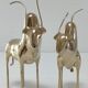 Two stylized zebu with long vintage brass horns