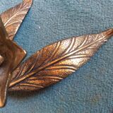 Flower of lilies wears golden 60s ashtrays