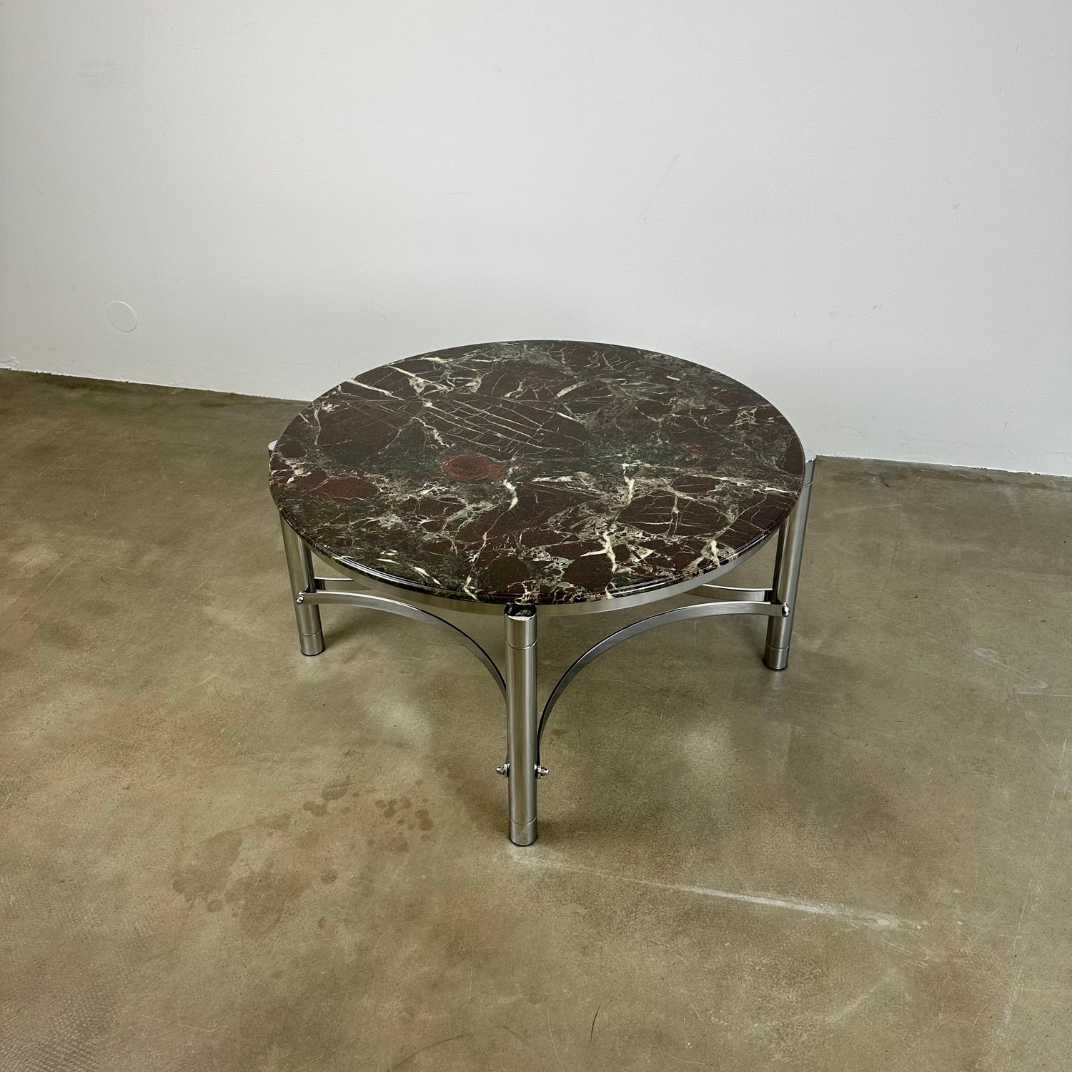 Coffee table with marble top and chrome base