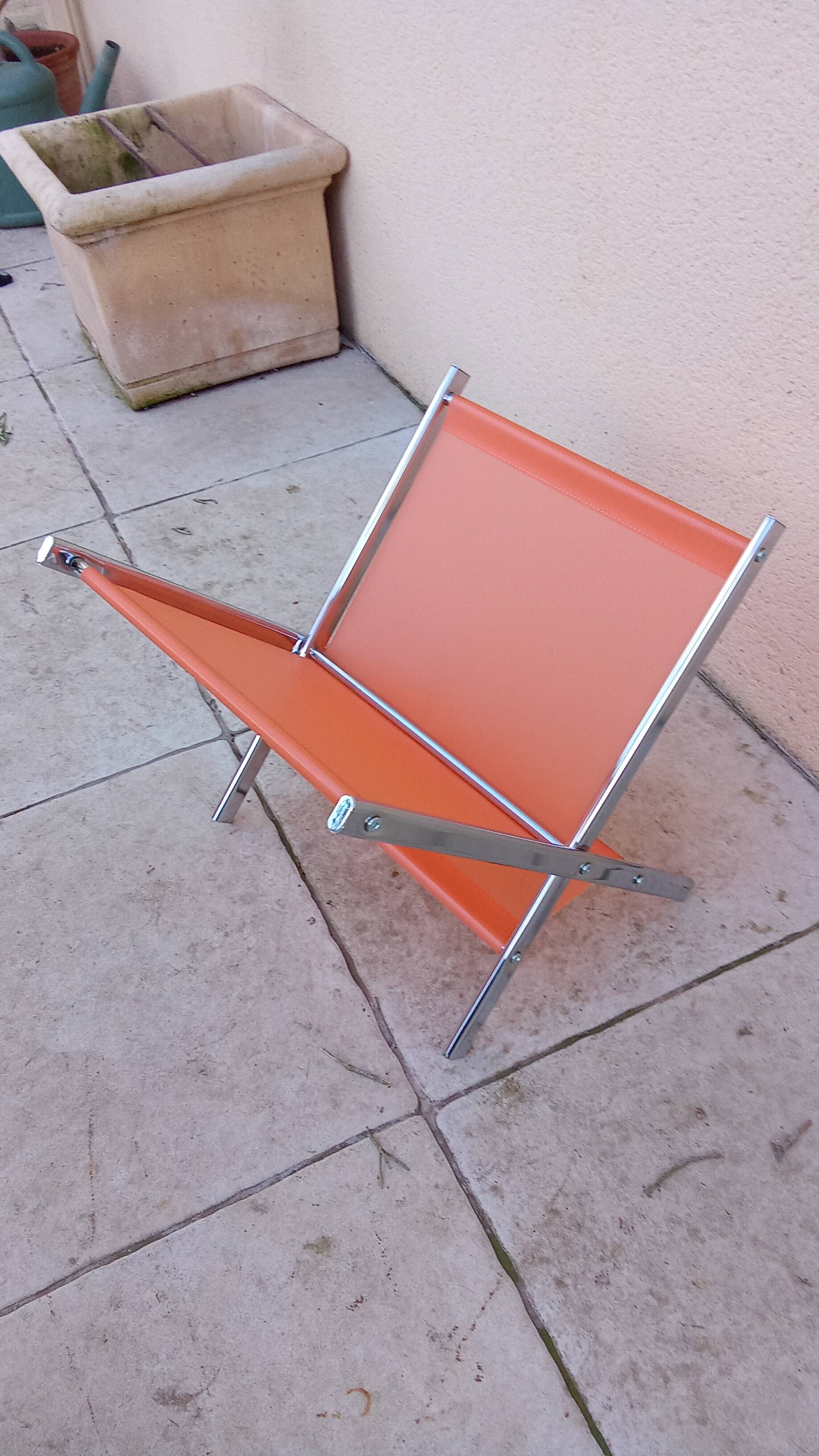 Vintage chrome and orange magazine rack from the 70s and 80s