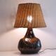 Ceramic and rattan lamp from the 20th century.