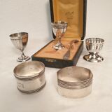 3 shells and 2 silver metal napkin rings