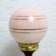 Turned wood and pink glass lamp