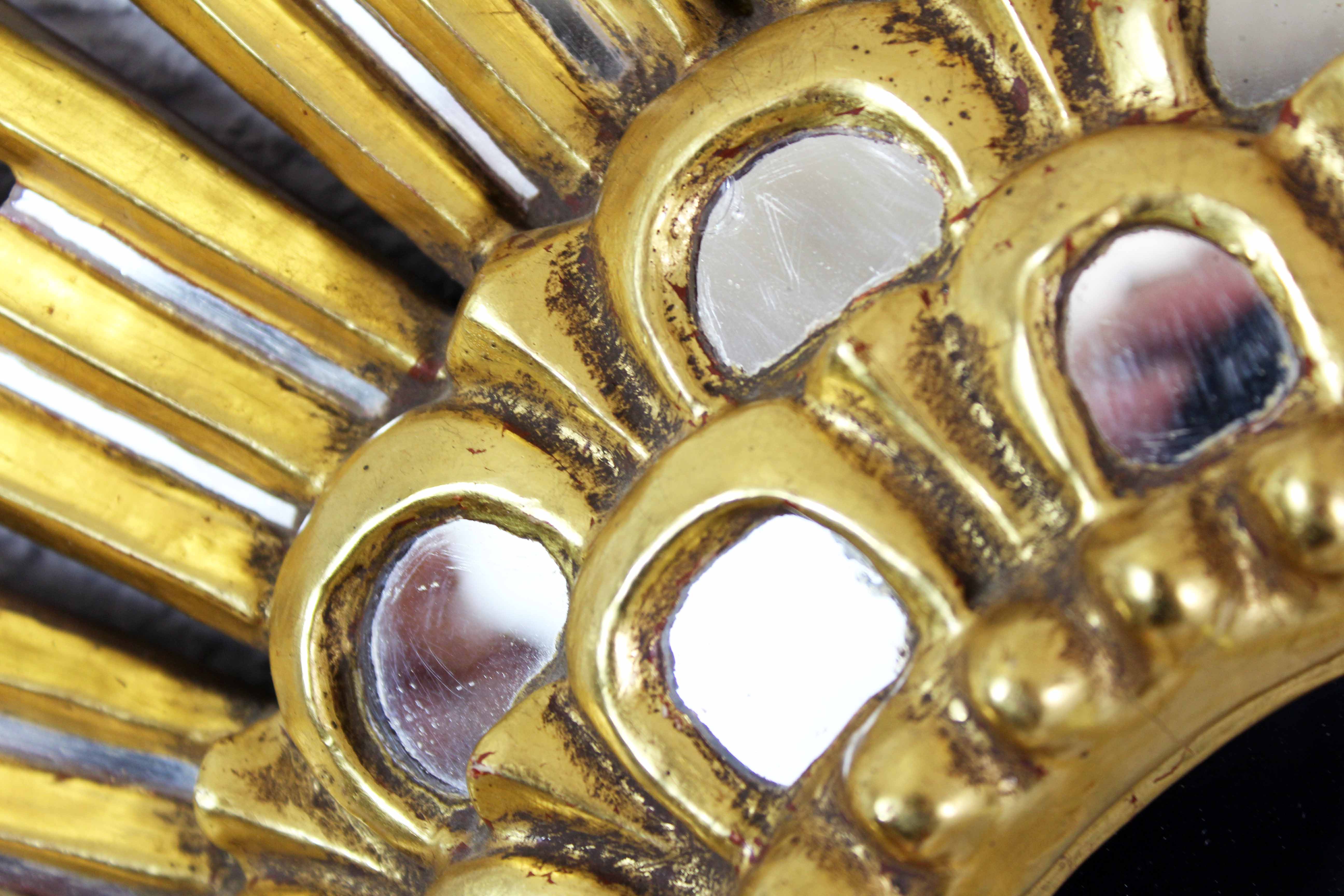 Sun mirror in wood and gilded stucco