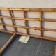 Grande banquette lit en rotin vintage