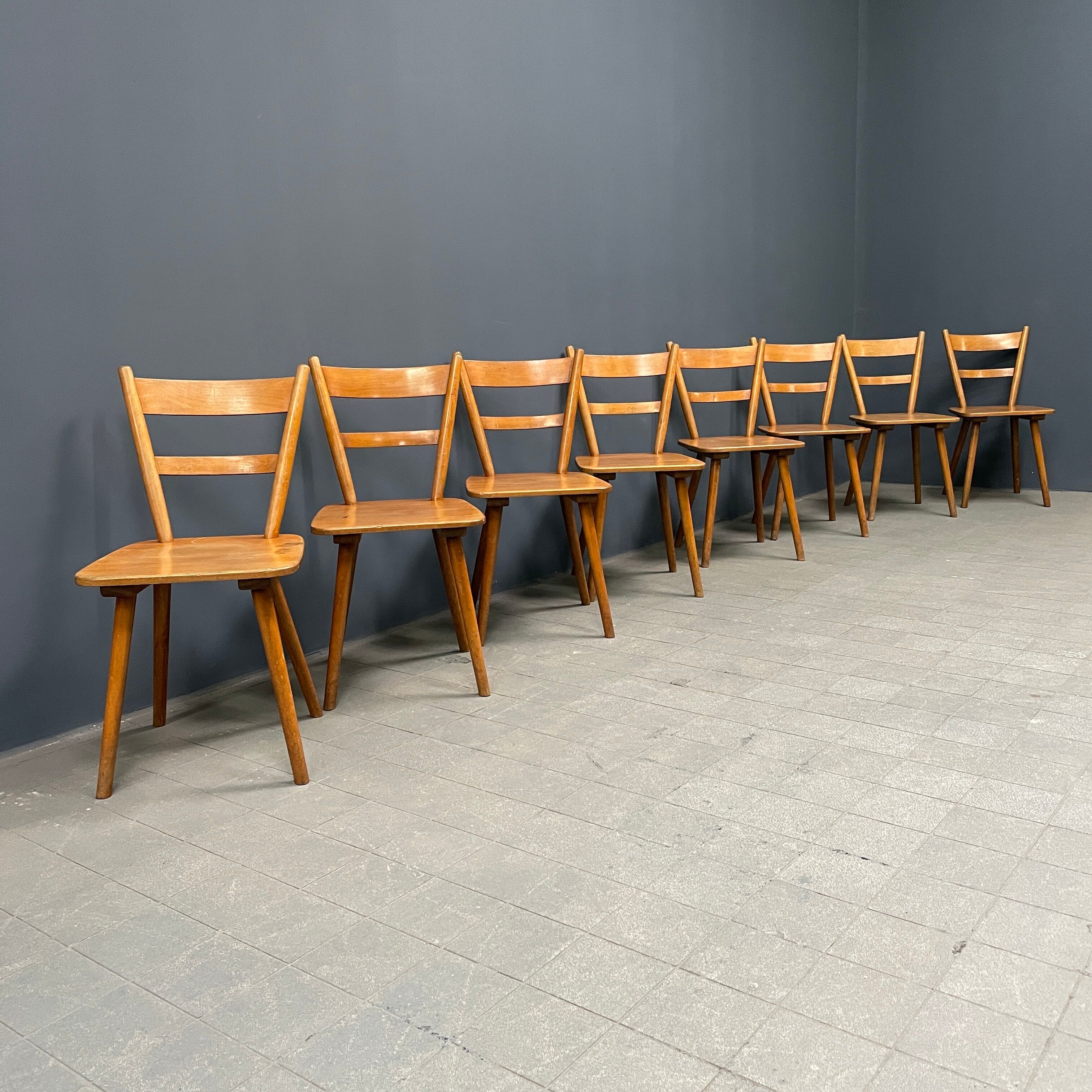 Set of eight german stick chairs from the 1950