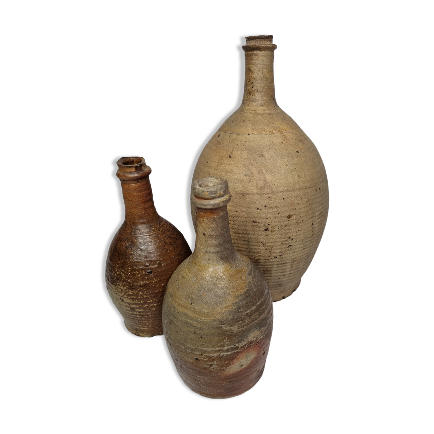 Set of three old enamelled terracotta bottles, 33 cm