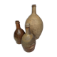 Set of three old enamelled terracotta bottles, 33 cm