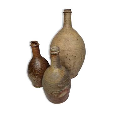 Ensemble de trois bonbonnes en terre cuite émaillée anciennes, 33 cm
