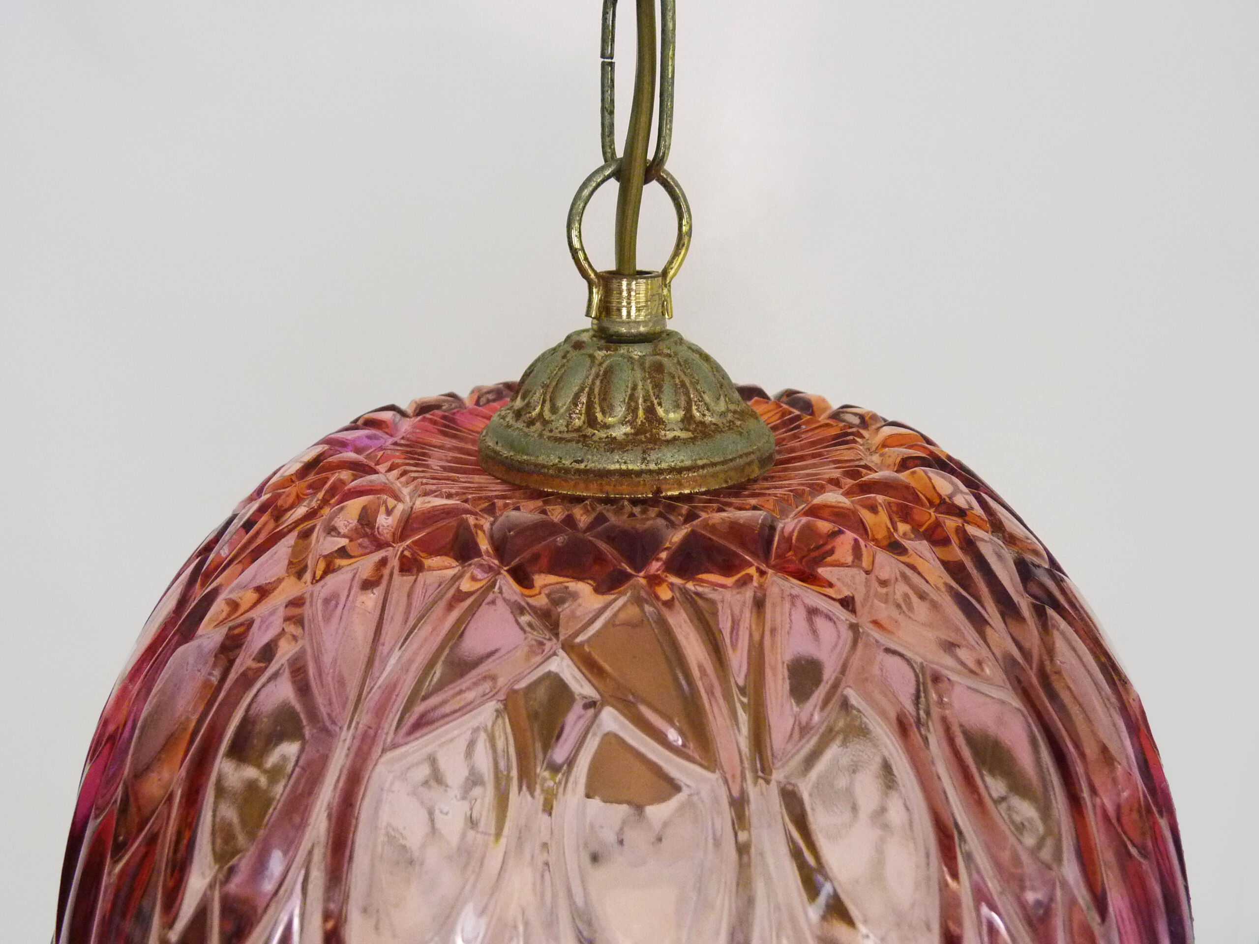 Vintage rose pendant light with pendants and patterned glass globe.