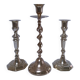 Three vintage solid brass candle holders