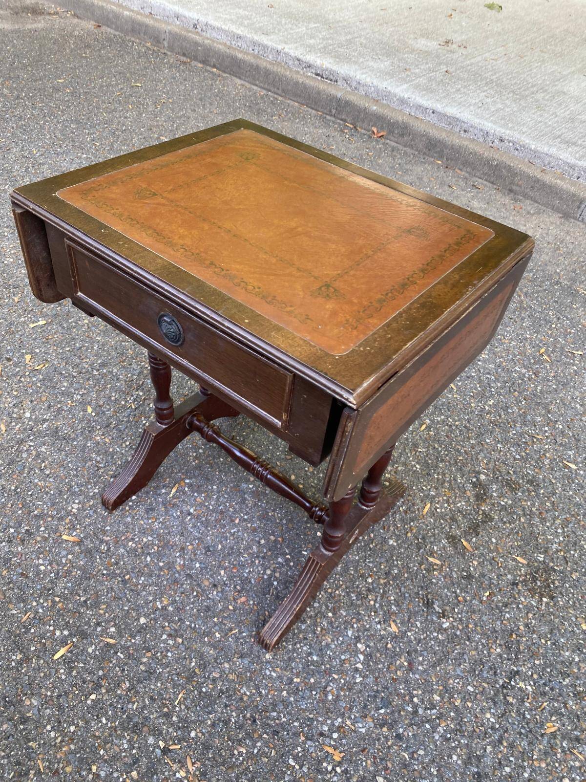 Small drop-leaf side table in English style with leather top & drawer.