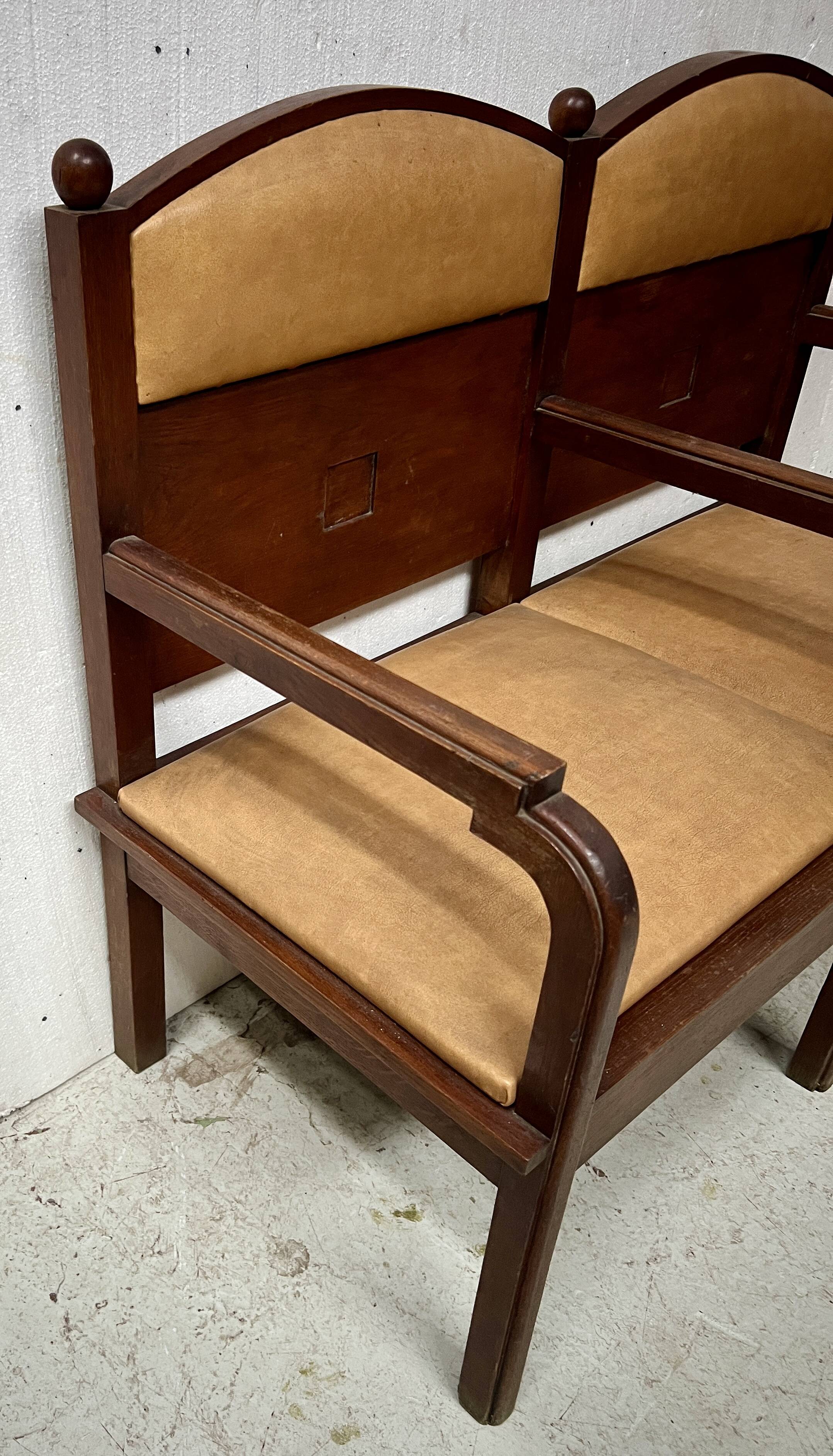 Art Deco two-seater bench in solid mahogany, 20th century.