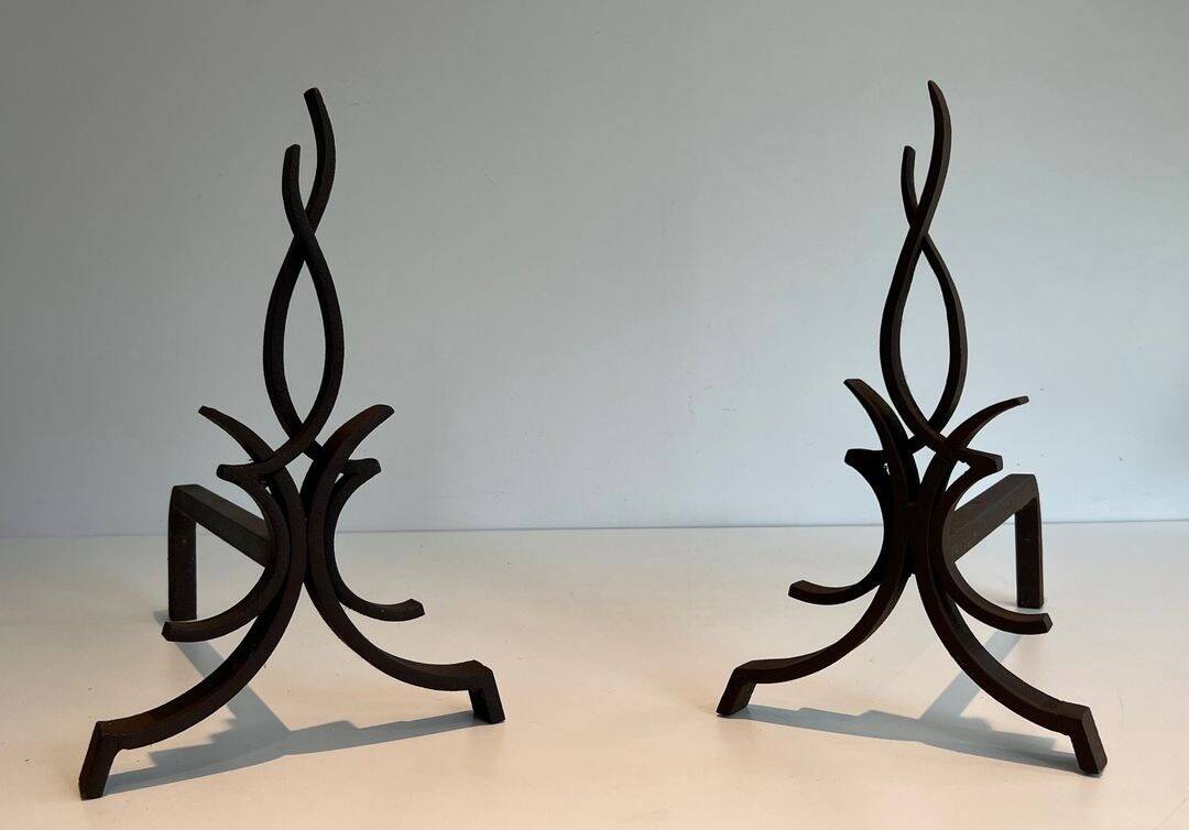 Pair of Wrought Iron Andirons with Stylised Flamboyant Uprights and Enrobed Feet