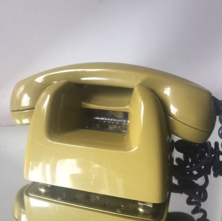 Vintage mustard green rotary telephone