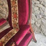 Louis-Philippe armchair in mahogany and burgundy velvet, floral decoration.